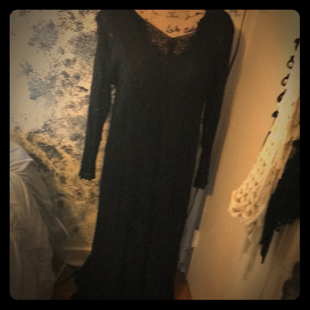 long black dress with black sleeveless cover under